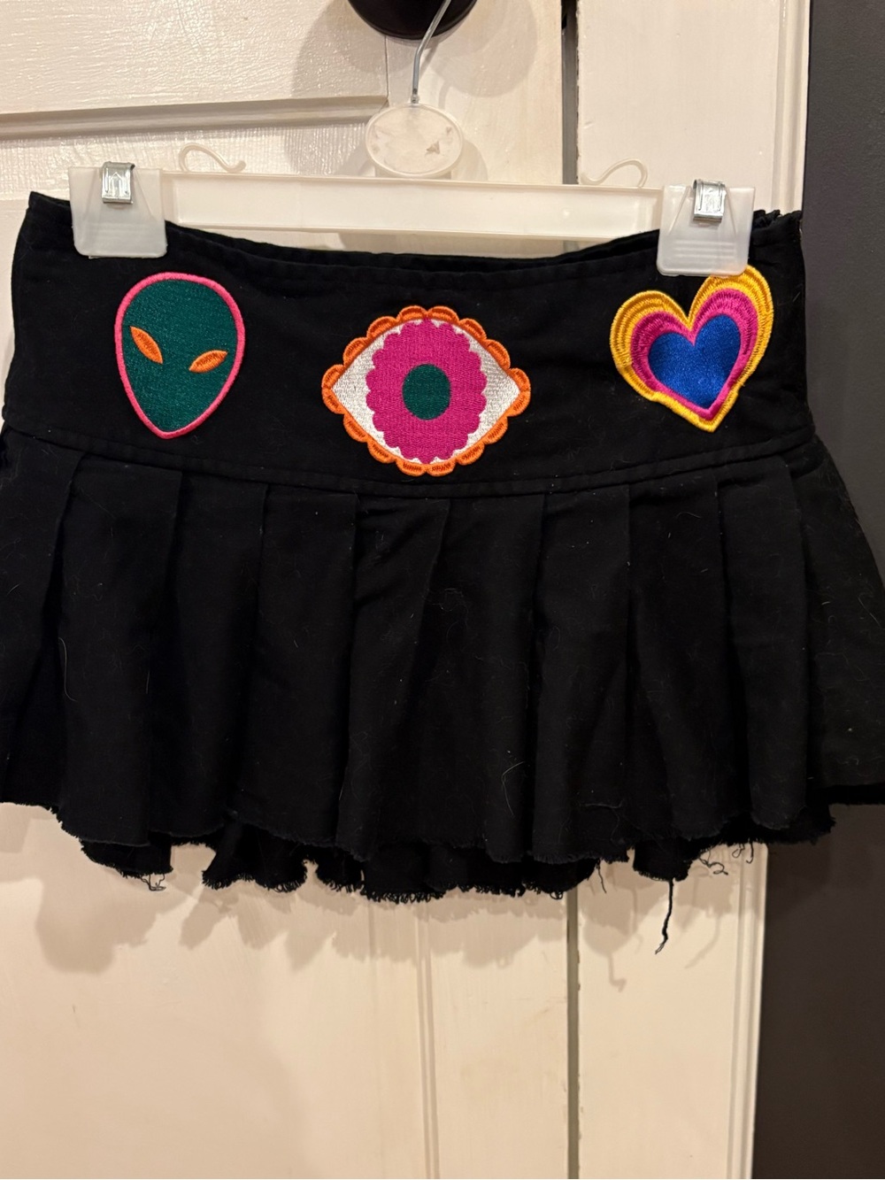 Current Mood Black Pleated Mini Skirt with Multicolor Patch Embellishments